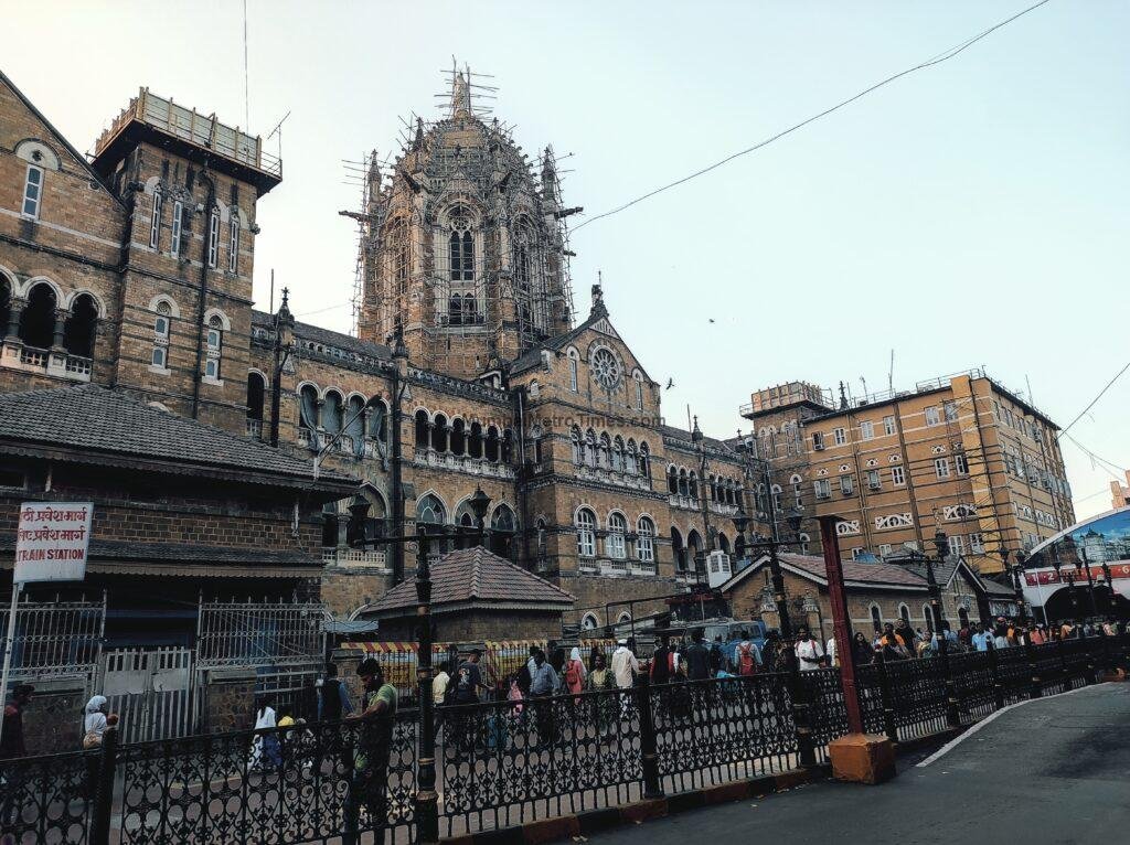 Towers and gables of the CSMT heritage building above the street railings